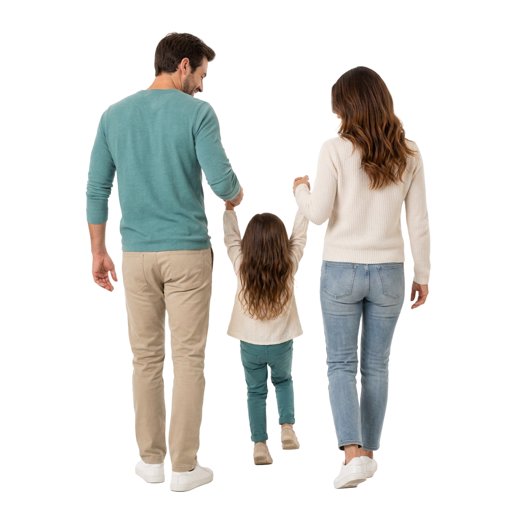 A couple walking away, playfully swinging their young child between them